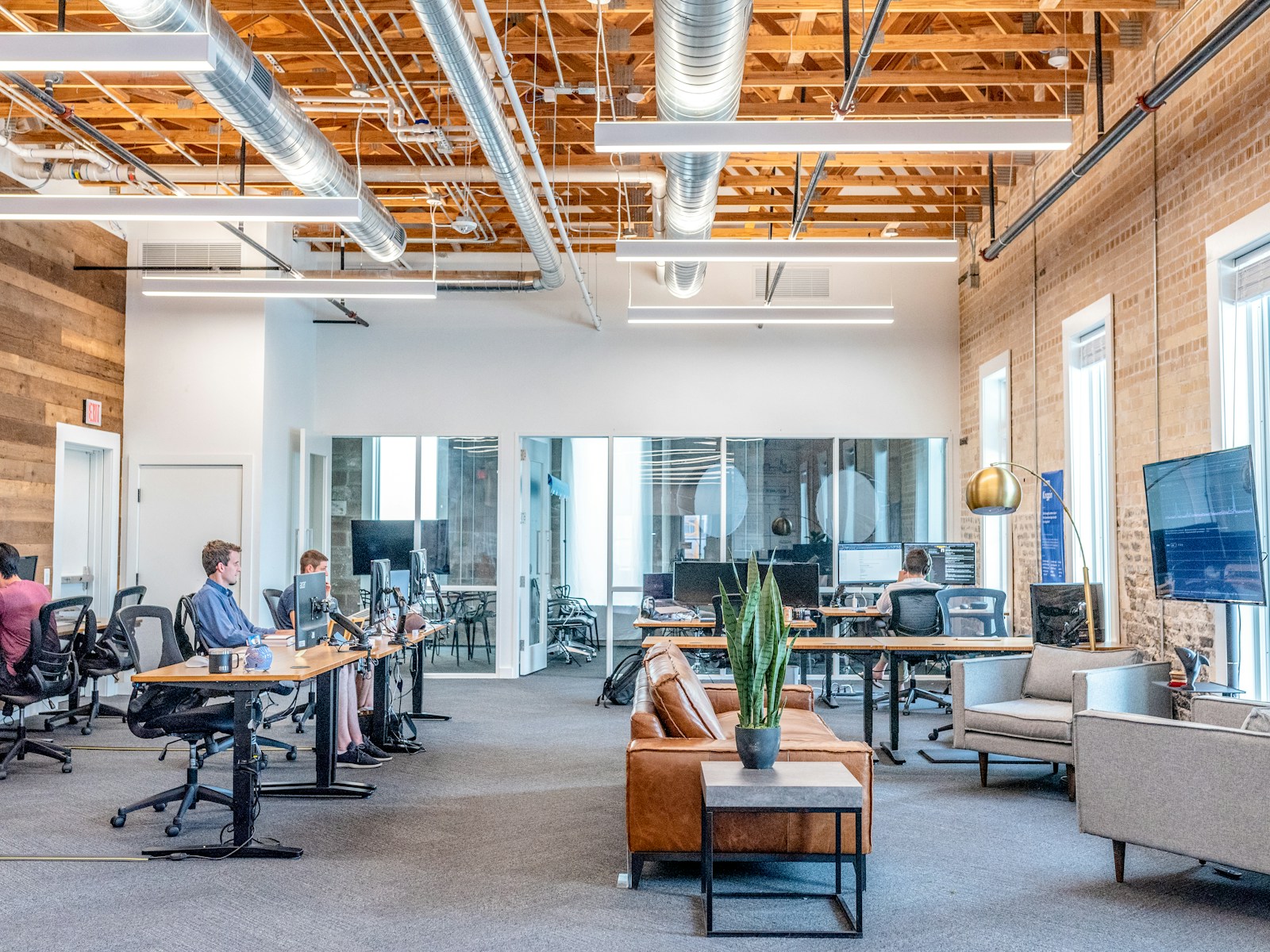 A shared workshop table on the Wealth AI Clash floor set up for a group cash-flow drill.